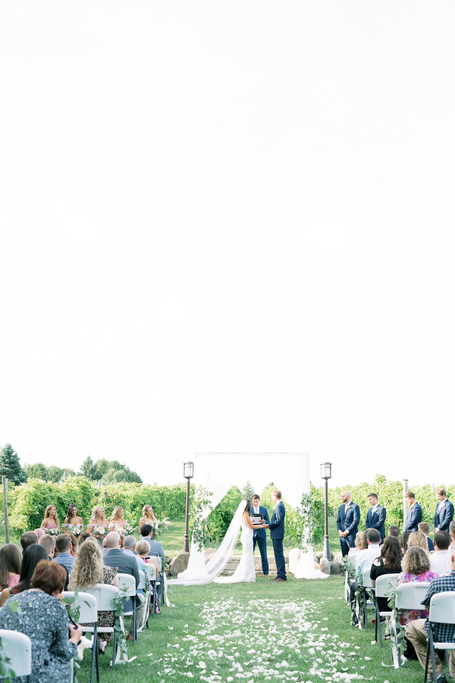 light and airy wedding Vineyard photos with white willow events at Prairie Moon Winery wedding in Ames, Iowa