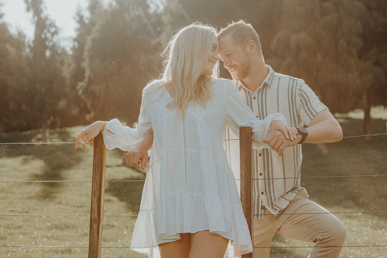 Engaged Couple at sunset for their home engagement shoot with Apertured Media-Auckland Wedding Photographer
