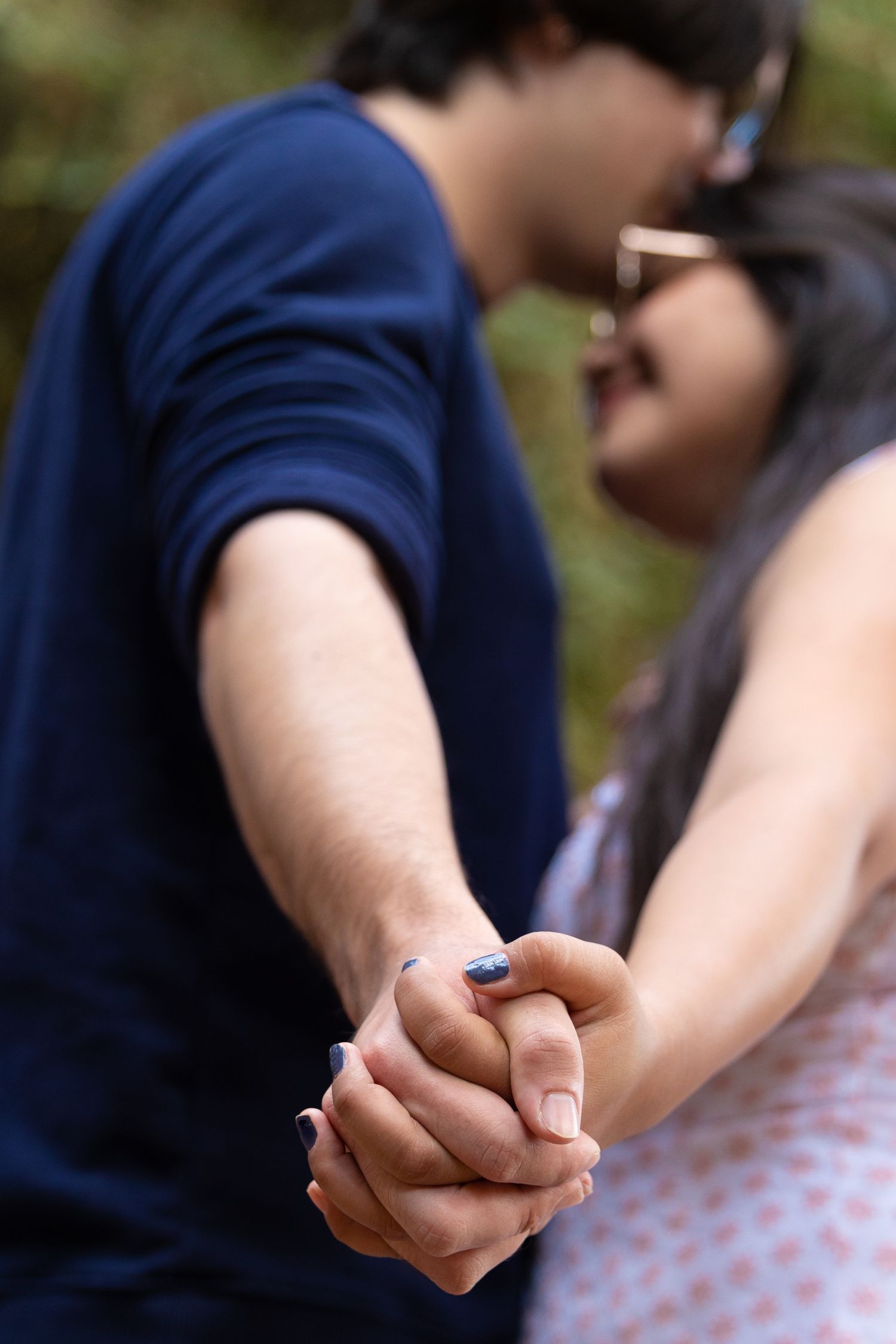 Couple holding hands.