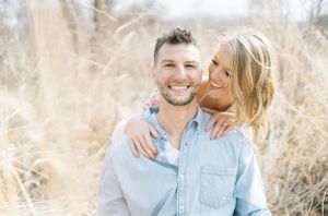 Light and airy film lakeside dock engagement session at Gray's Lake in Des Moines, Iowa