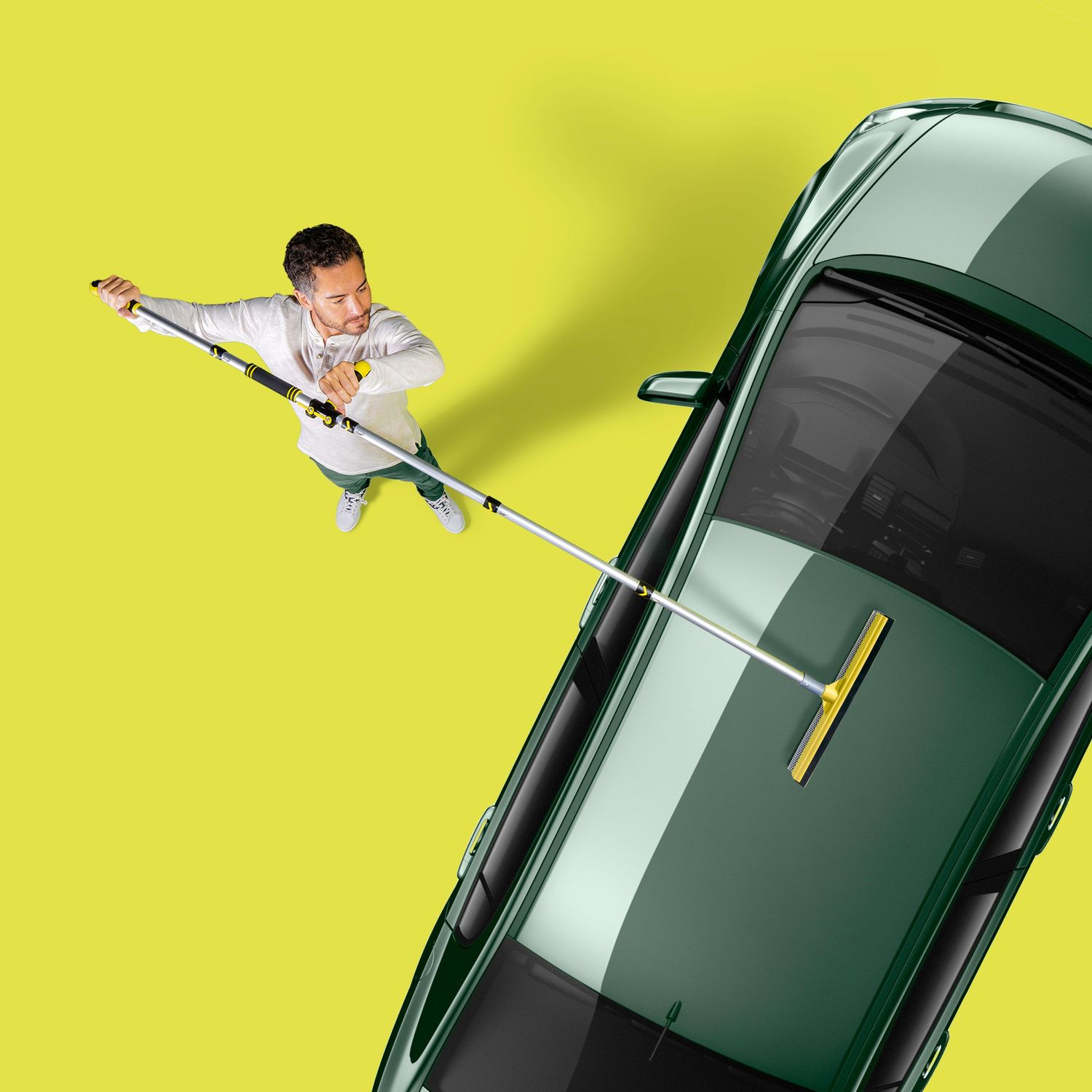 Creative overhead view of cleaning service concept with car and extending mop on yellow background.