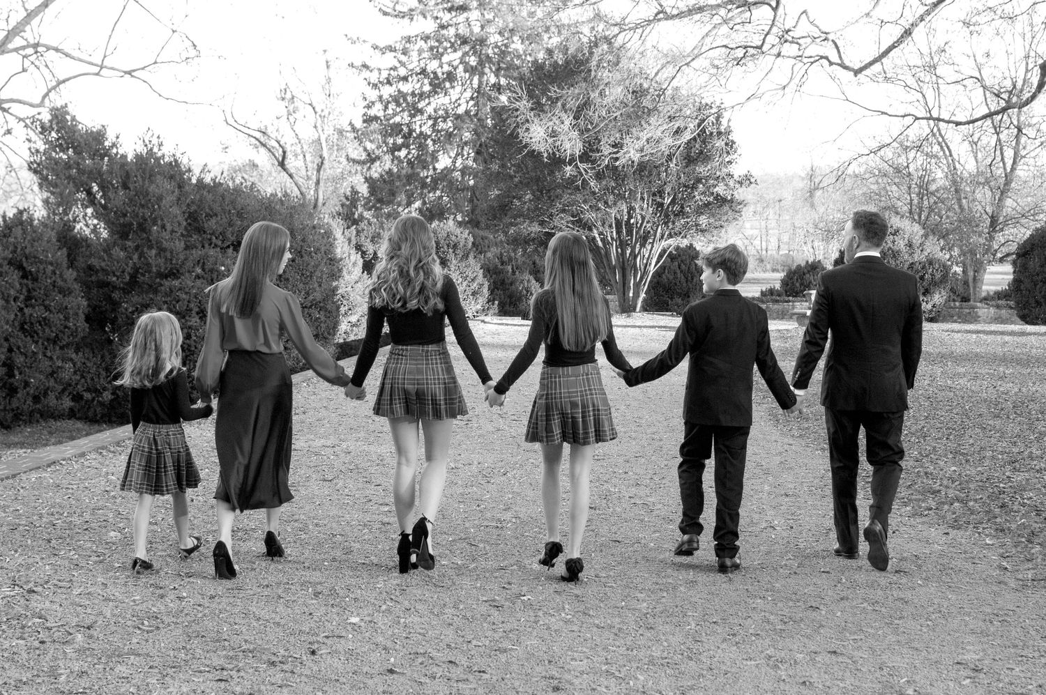 Family holding hands photo black and white