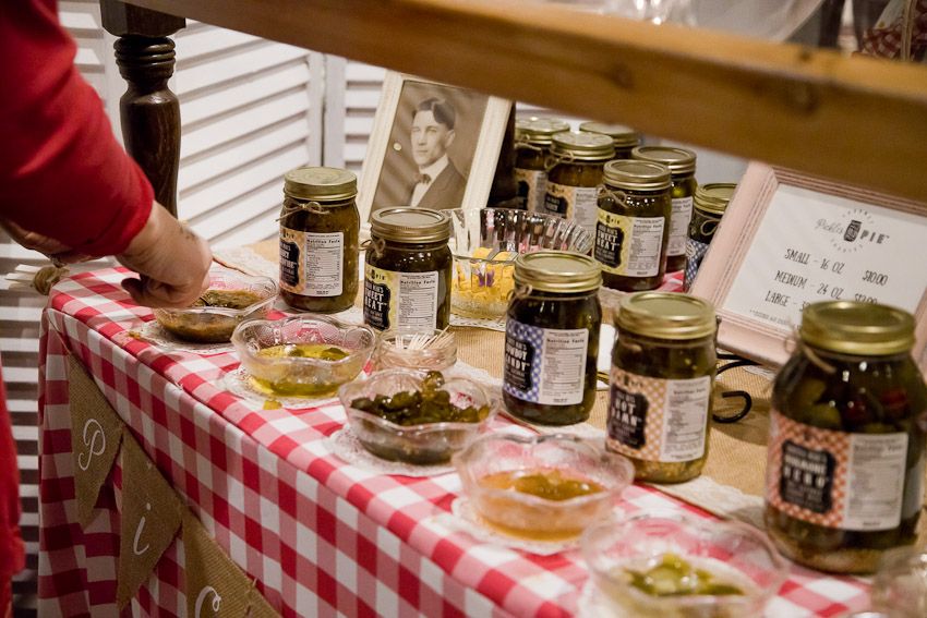Pinology Puyallup Pickles and Pie Booth customer trying sample of salsa