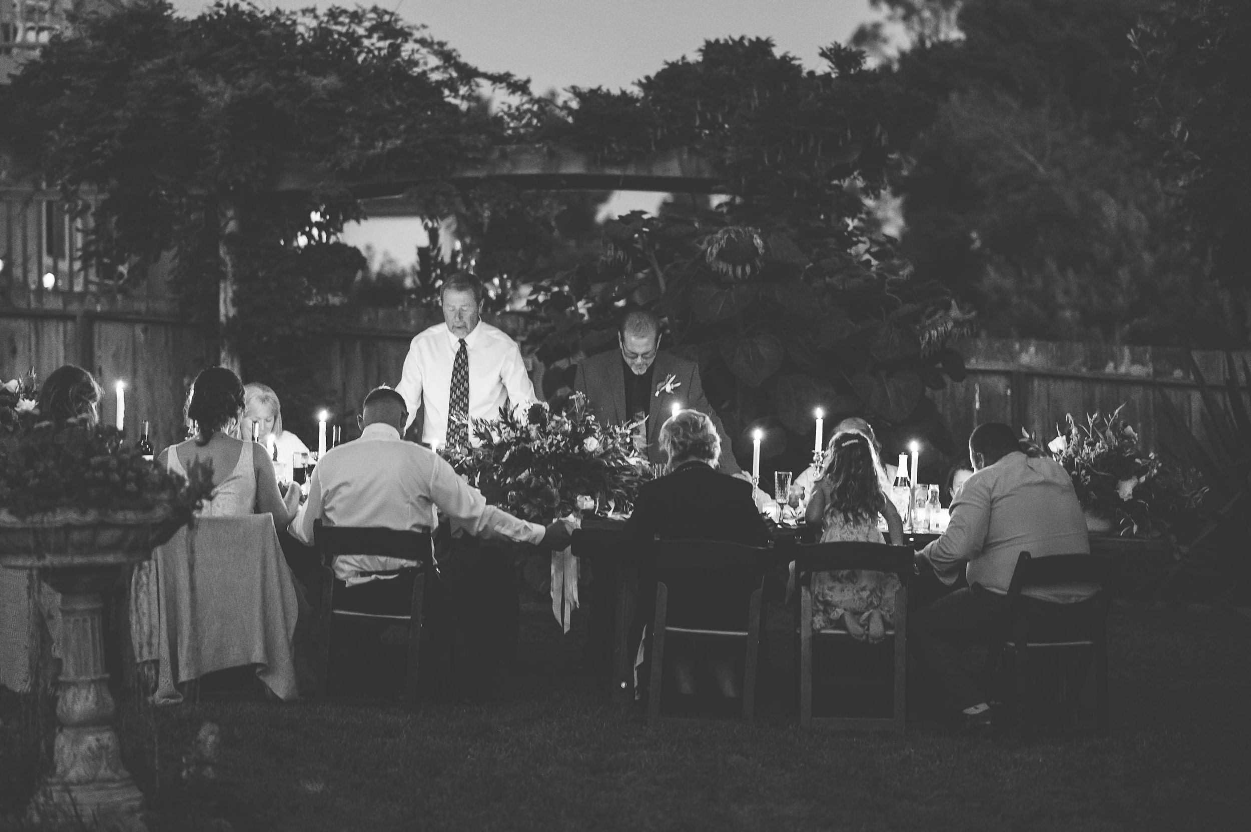 Saying grace at this intimate backyard wedding in Santa Cruz