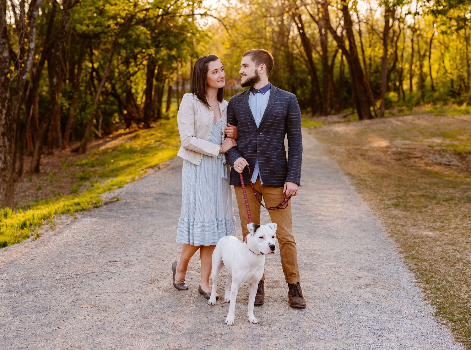 Chattanooga engagement photographer Sarah Swainson captures a couple with their dog at Coolidge Park