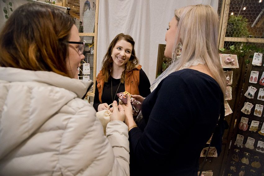Pinology Puyallup ELM Earrings and Hair accessories Booth owner interacting with customers and making a sale