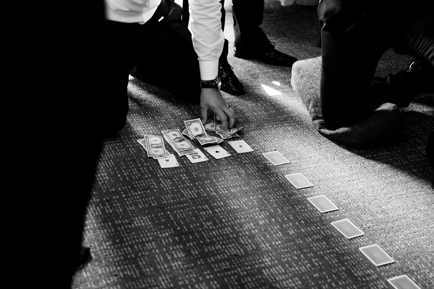 groomsmen play card games before chicago wedding event