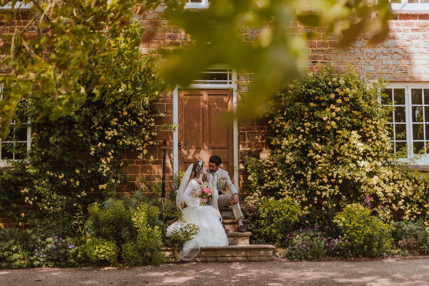 Newly weds enjoy 5 minutes alone time outside at Northamptonshire wedding venue Crockwell Farm