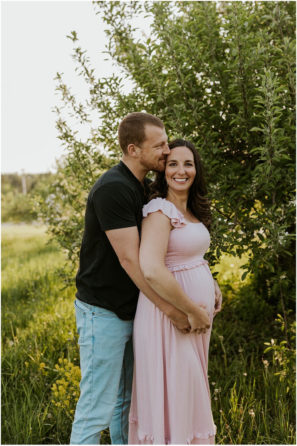 Couple taking pregnancy announcement photos in New Hampshire