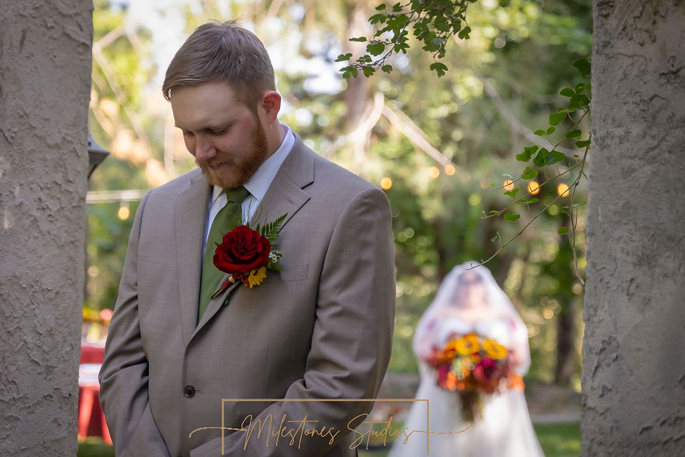 first look groom waiting bride in distance