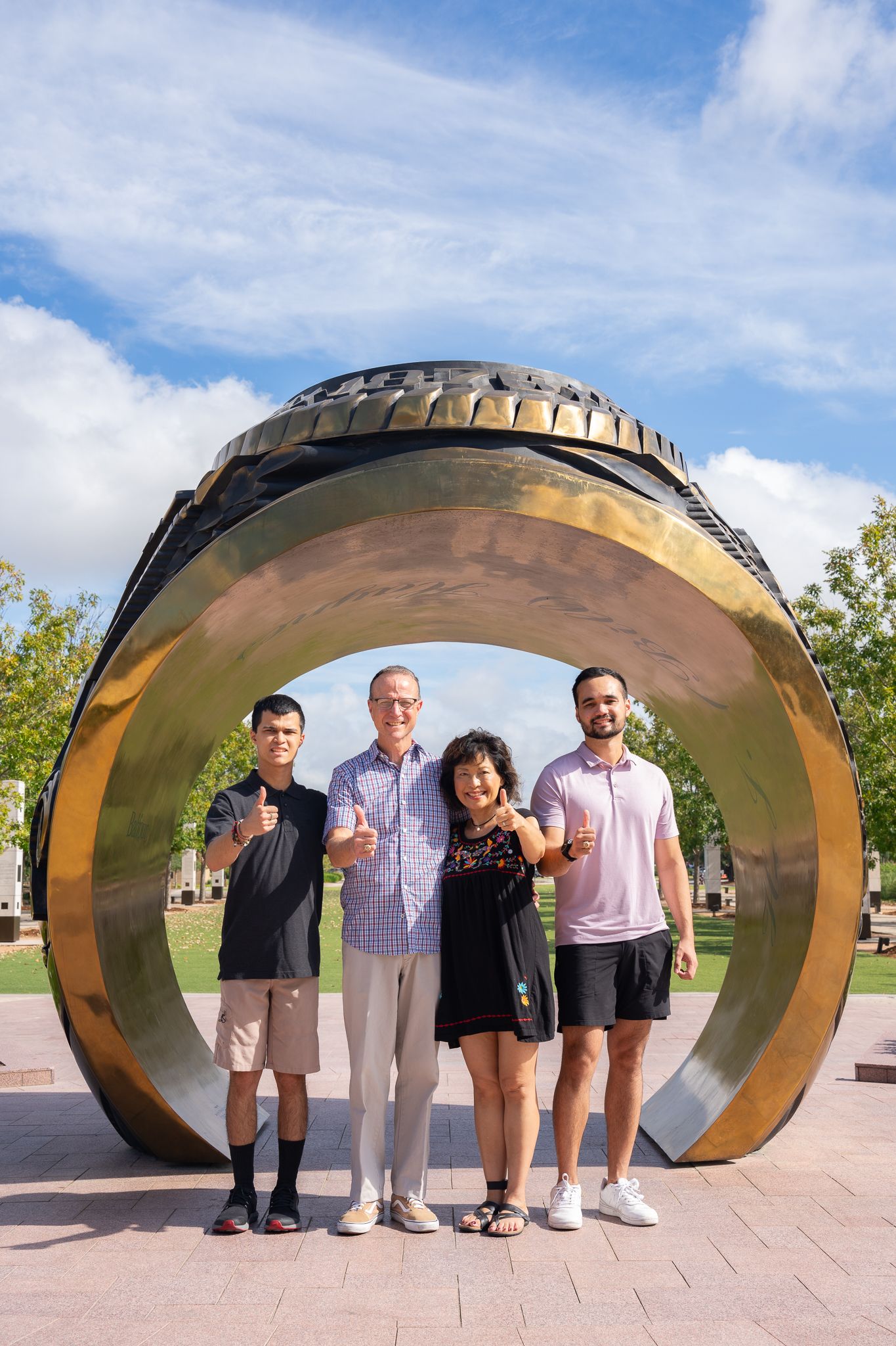 Family portraits in Aggie Park showcasing families enjoying quality time in a beautiful outdoor setting.