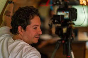Behind the scenes film production setup with camera equipment and crew.