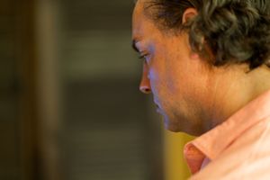 A profile view of a person in contemplative thought.
