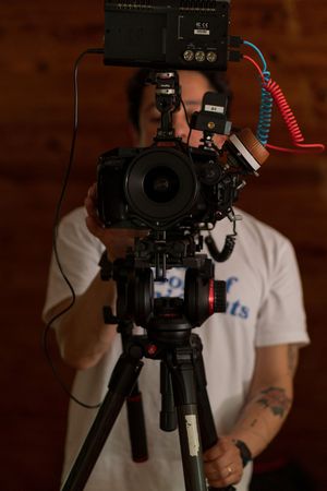 Professional cinema camera rig setup with multiple attachments and controls.