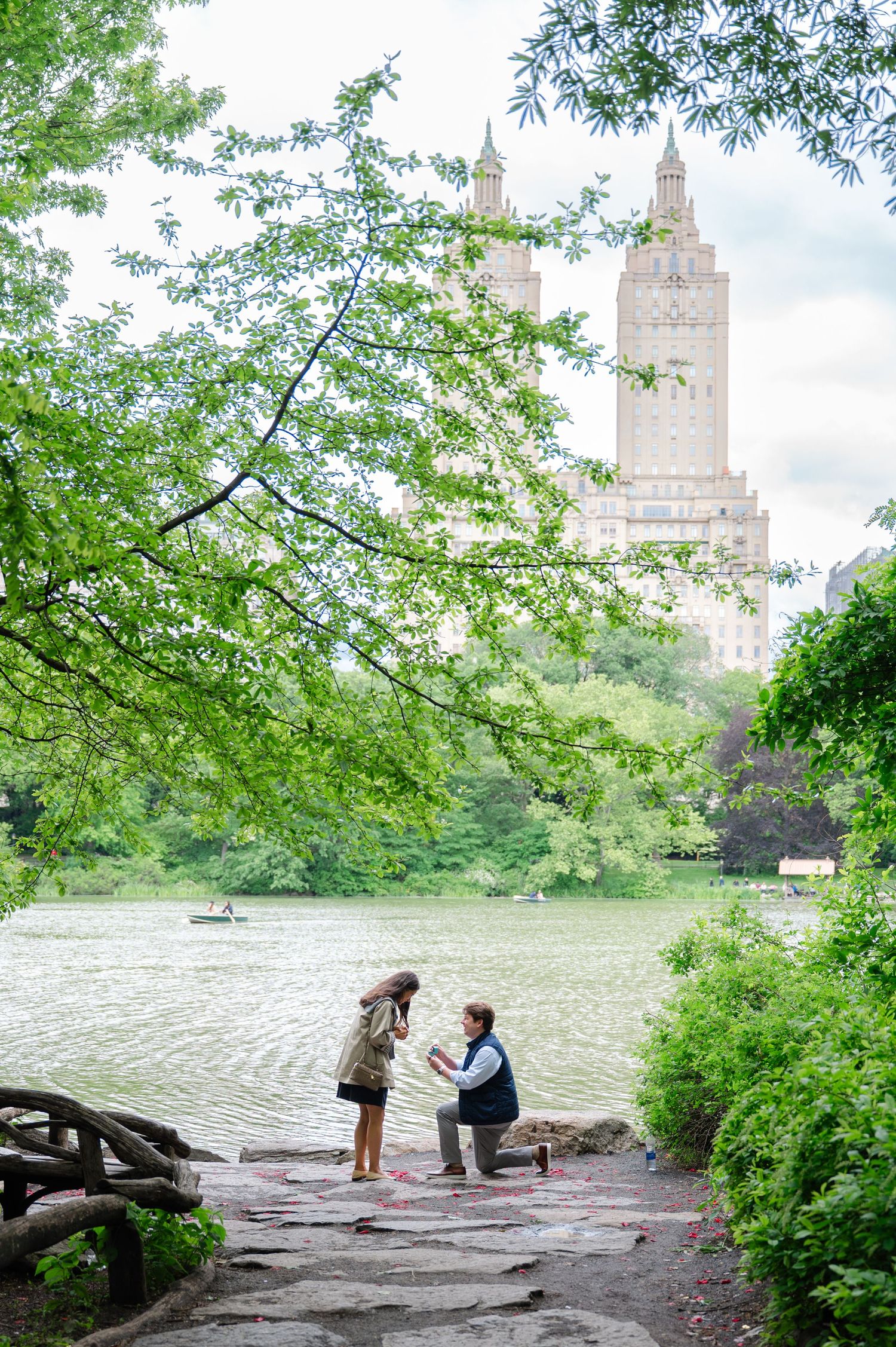 Surprise proposal in Central Park’s Ramble with a view of the San Remo, photographed by NYC proposal photographer Joliette Marie Photography