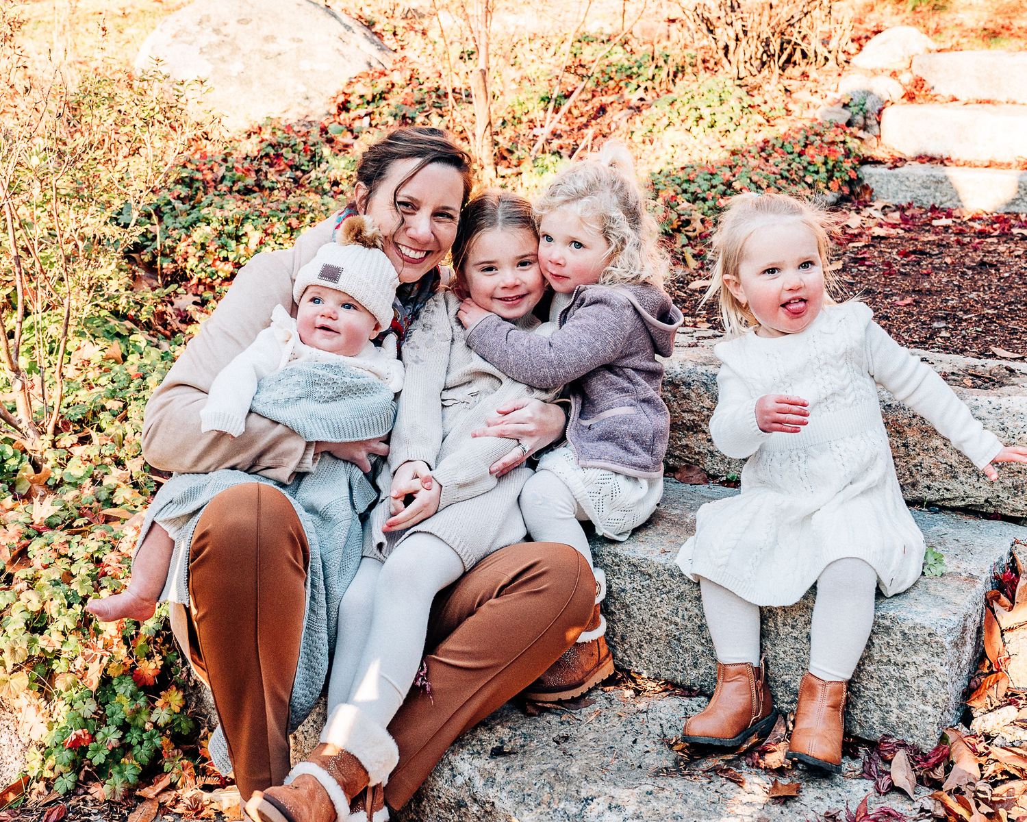 A series of candid family portraits taken outdoors in warm autumn light showing playful interactions on stone steps.