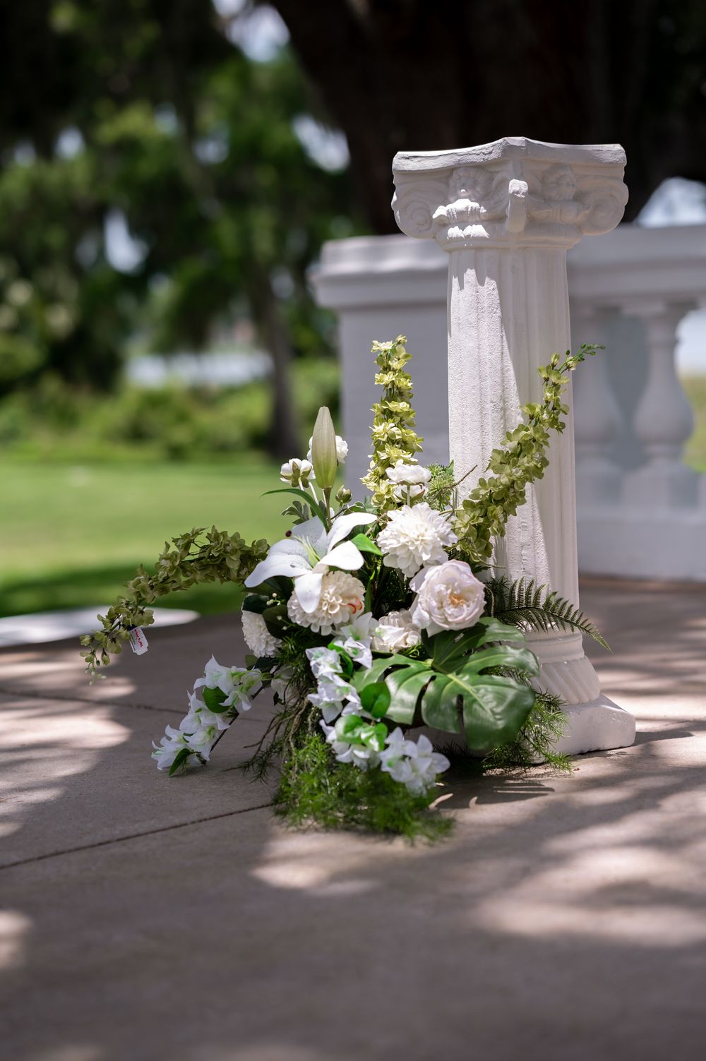 Palm Beach wedding photographers capturing faux floral arch by FauxReal Flowers
