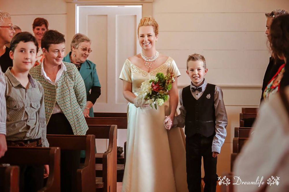 Candid moments captured at a church wedding ceremony with guests seated in wooden pews.