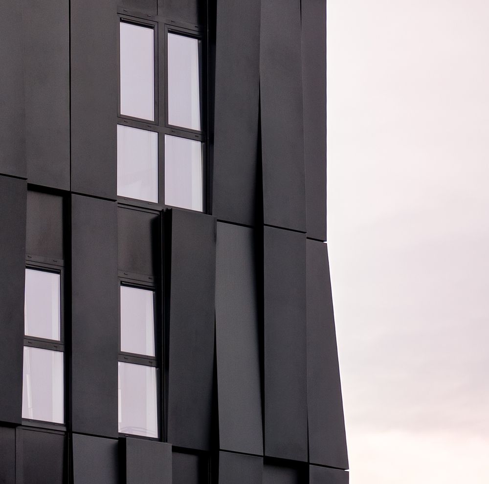 Architectural detail of The Dean Cork’s facade with modern cladding and sharp lines — captured by Rodrigo Llopis G.