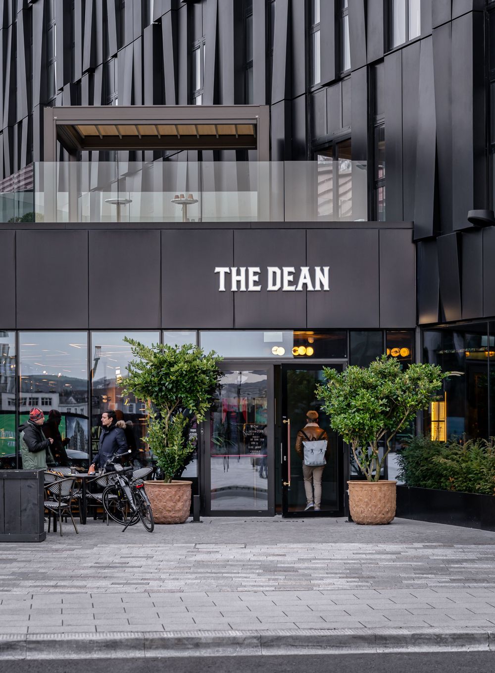 Street-level view of The Dean Cork entrance with modern facade — architectural and commercial photography by Rodrigo Llopis G.