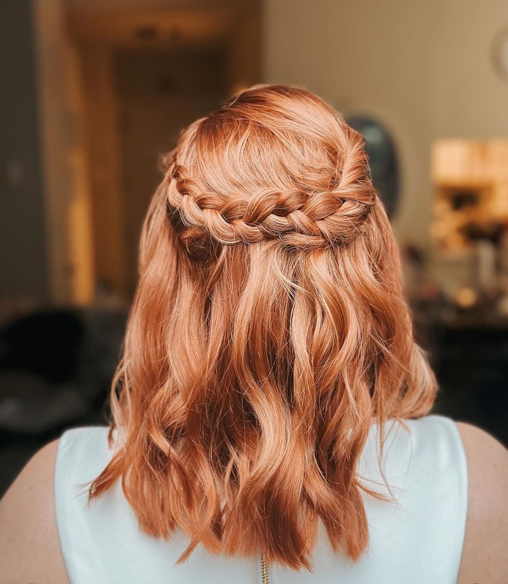 Beautiful braided crown hairstyle in copper red tones.