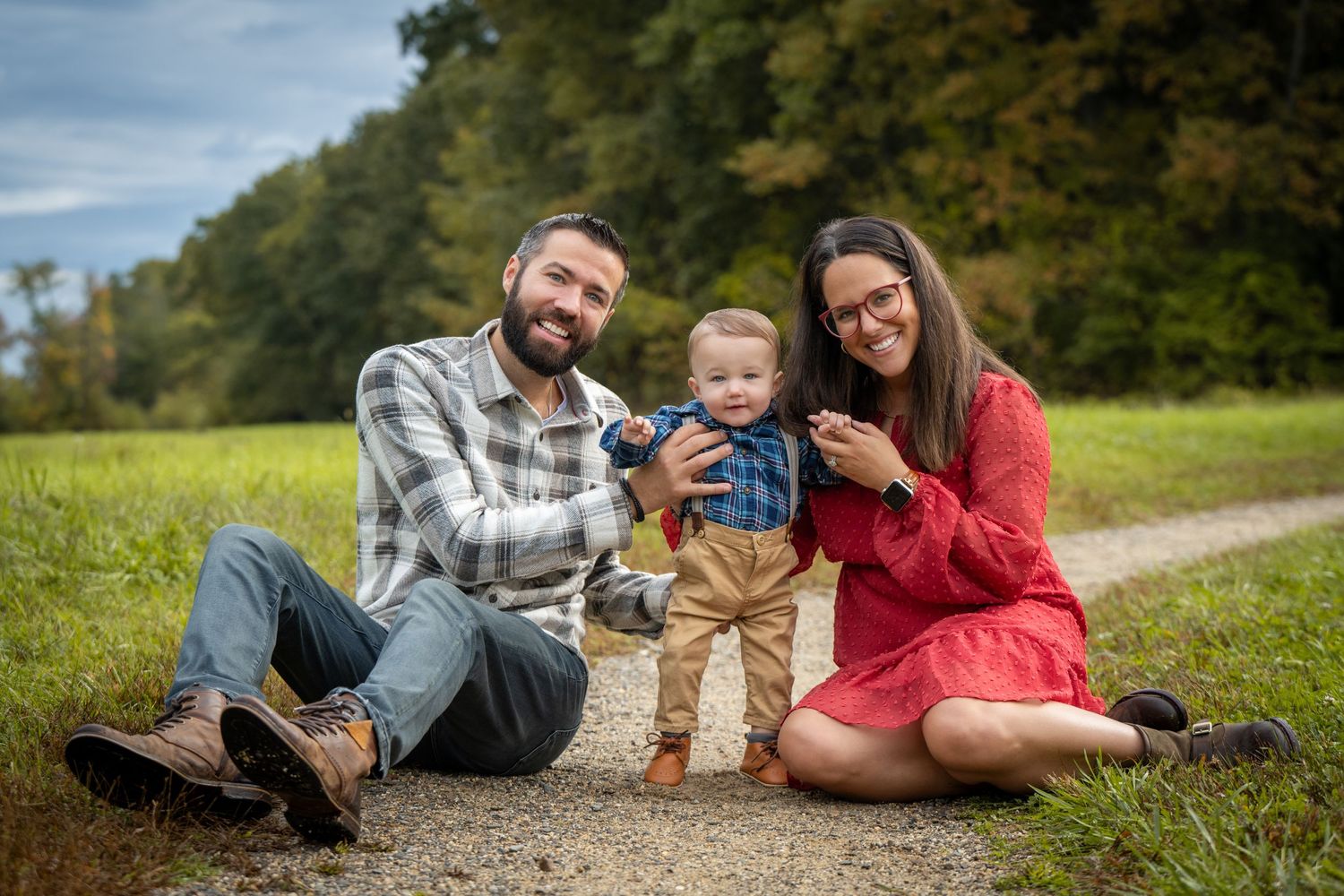 A family portrait in a sunlit field at golden hour with young children. Massachusetts Family Photographer Serving New England Affordable