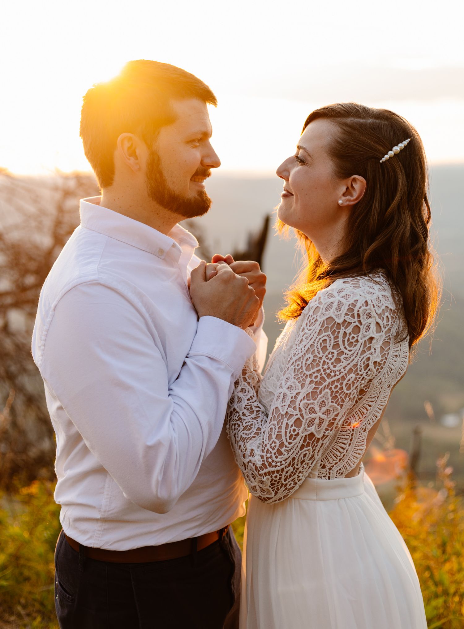 Chattanooga vow renewal couple holds hands at sunset on Lookout Mountain.