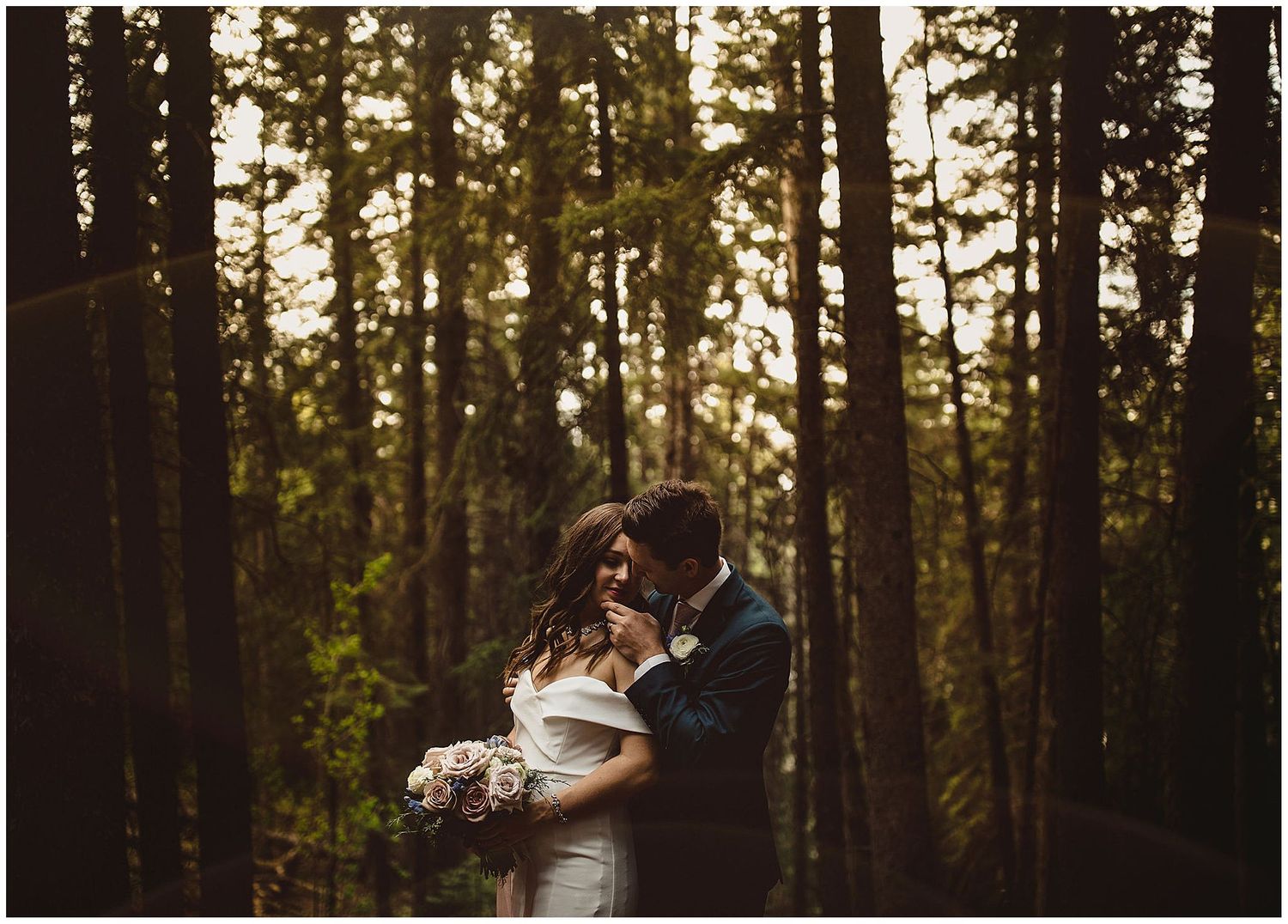 Calgary wedding photographer takes couple into trees