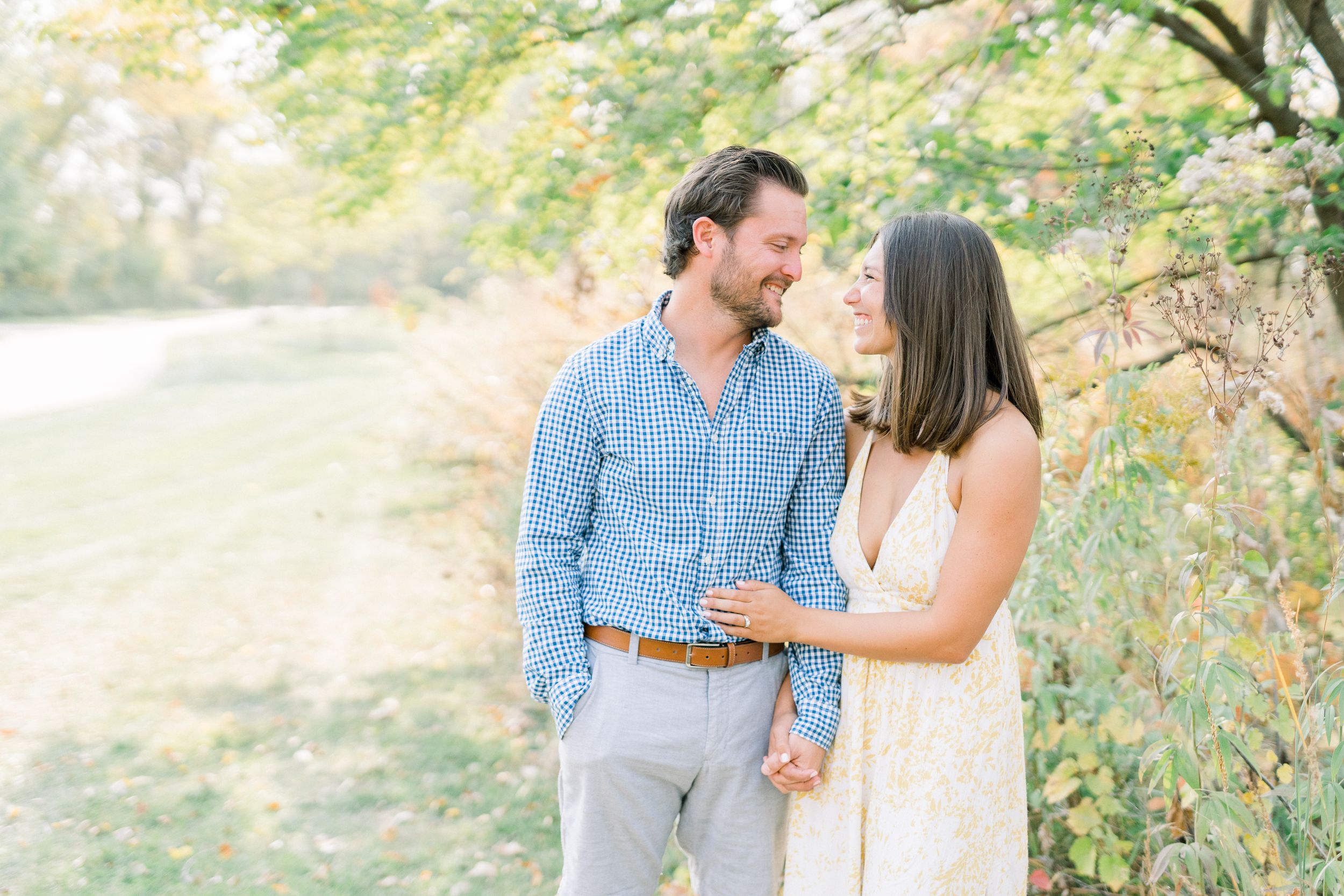 Light and airy film engagement photos in Des Moines, Iowa at downtown des moines