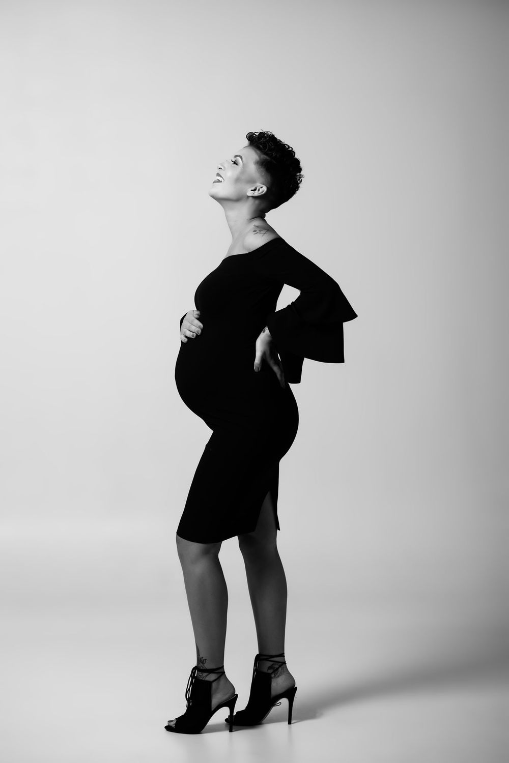 Omaha Maternity photography of a gorgeous mama in a black dress.