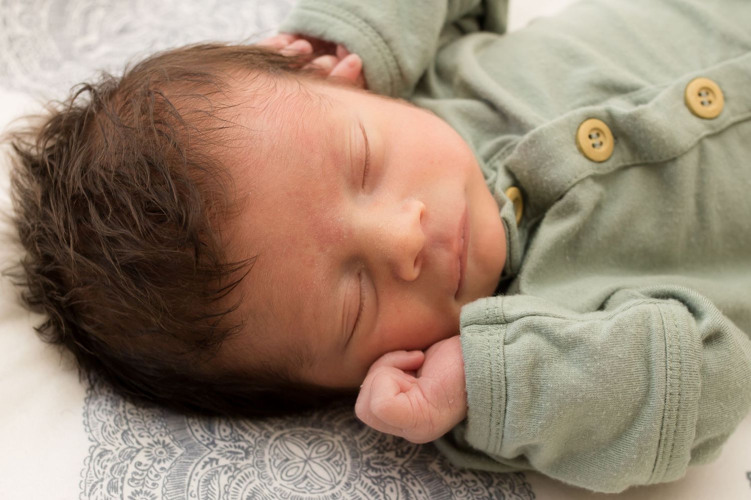 Newborn baby sleeping during newborn photography session in Longmont Colorado