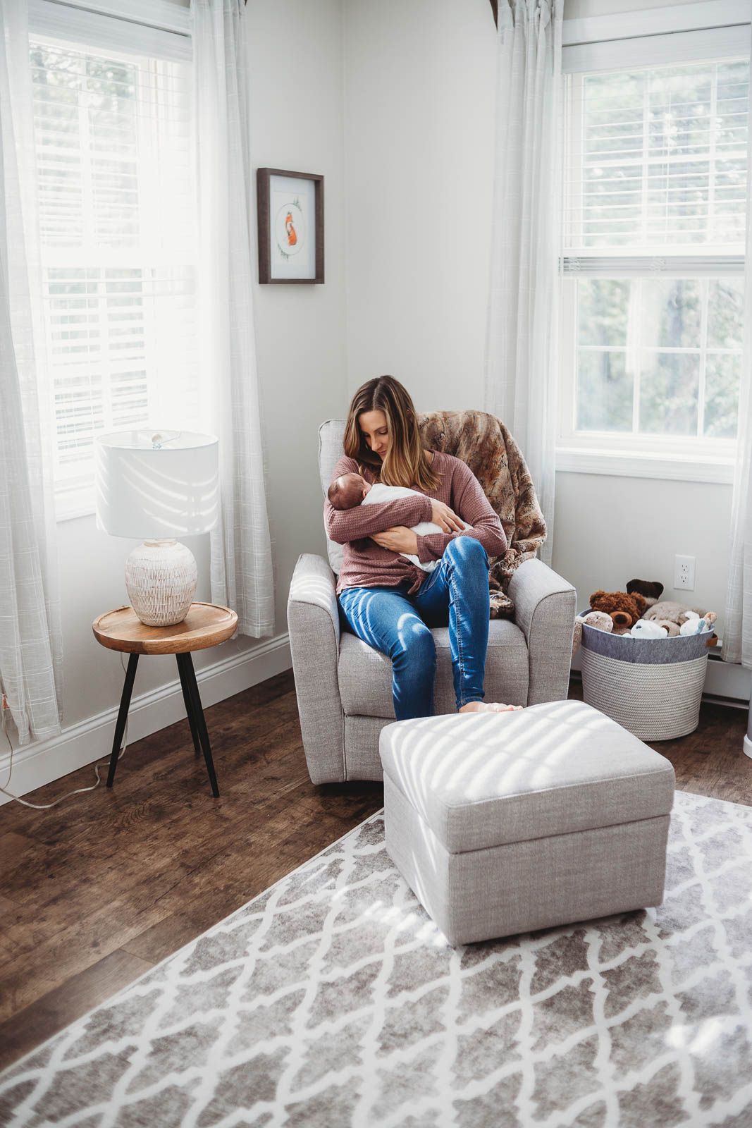mom holding baby by boston newborn photographer