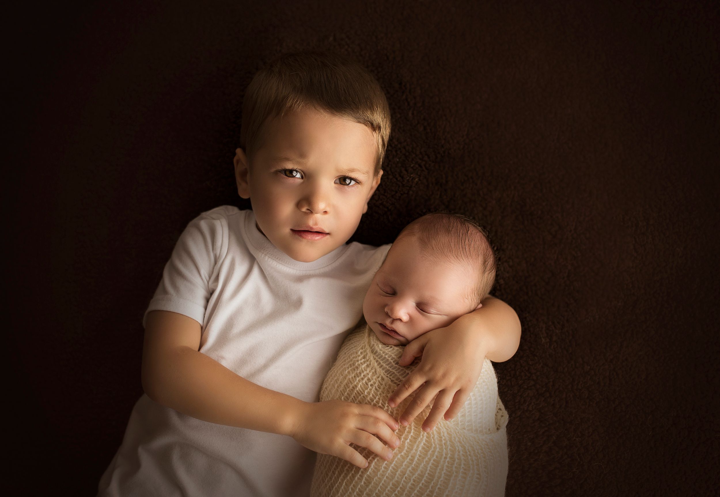 big brother holding little brother