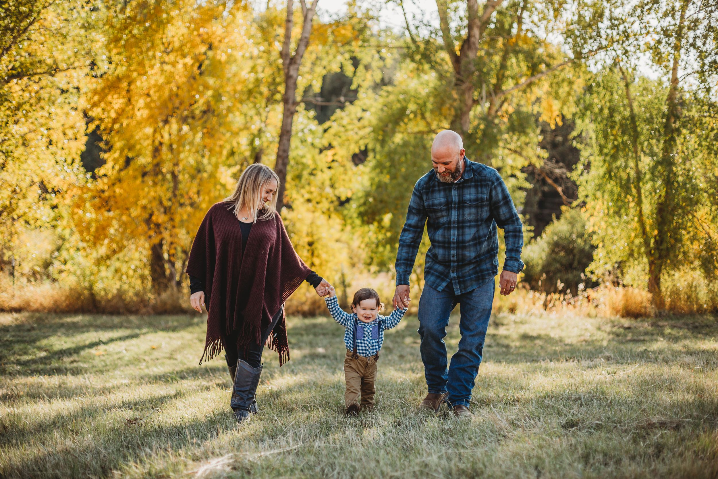 Family walks through the Rocky Mountains during their Family Session in Fort Collins, Colorado.