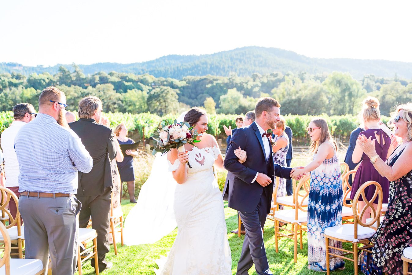 bride and groom walk through guests after getting married on Pennyroyal Farm in Anderson valley