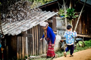 Environmental portrait of young and old life in a Akha Tribe village in Northern Thailand