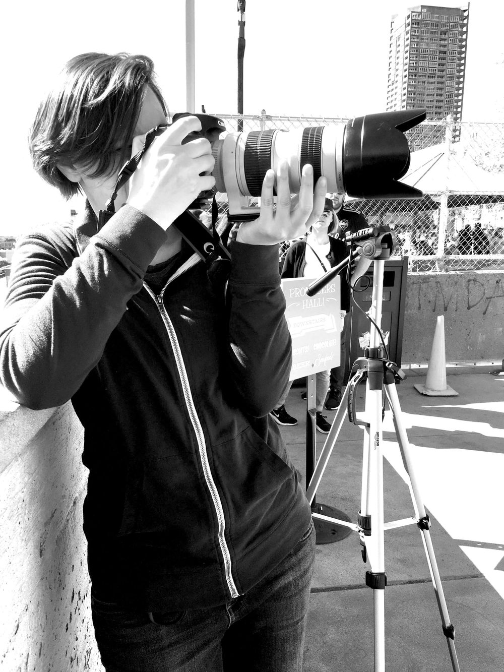 Photographer Shaya Lyon shooting on location at the Pike Place Market in Seattle.