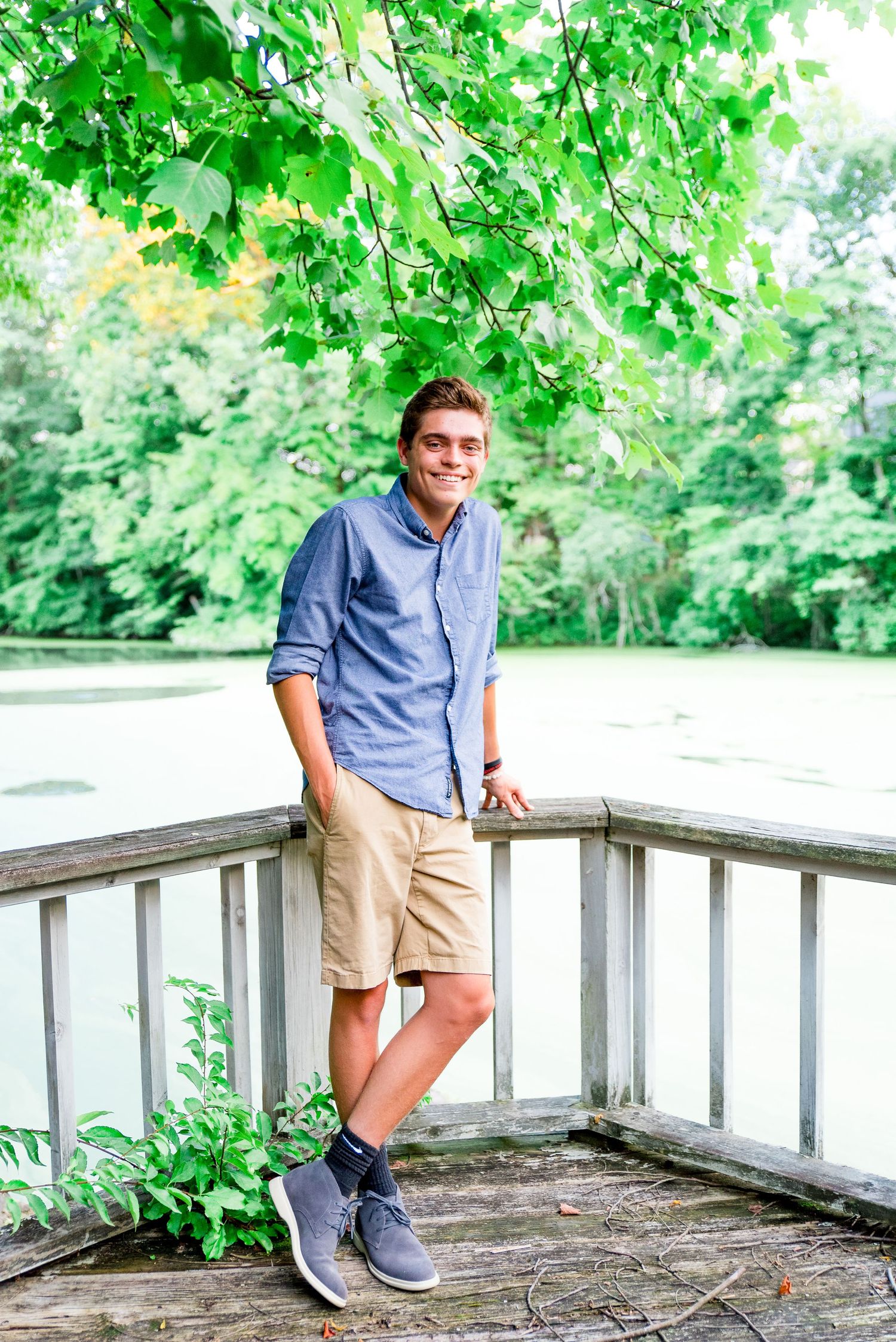 teenage boy, family photos, standing on balcony, pond, outdoors, summer, Cincinnati OH