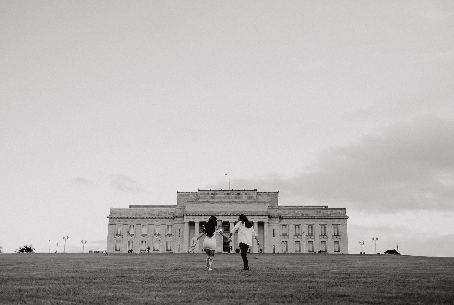 Lover's in their engagement shoot towards the Auckland Museum with Apertured Media-Auckland Wedding Photographer