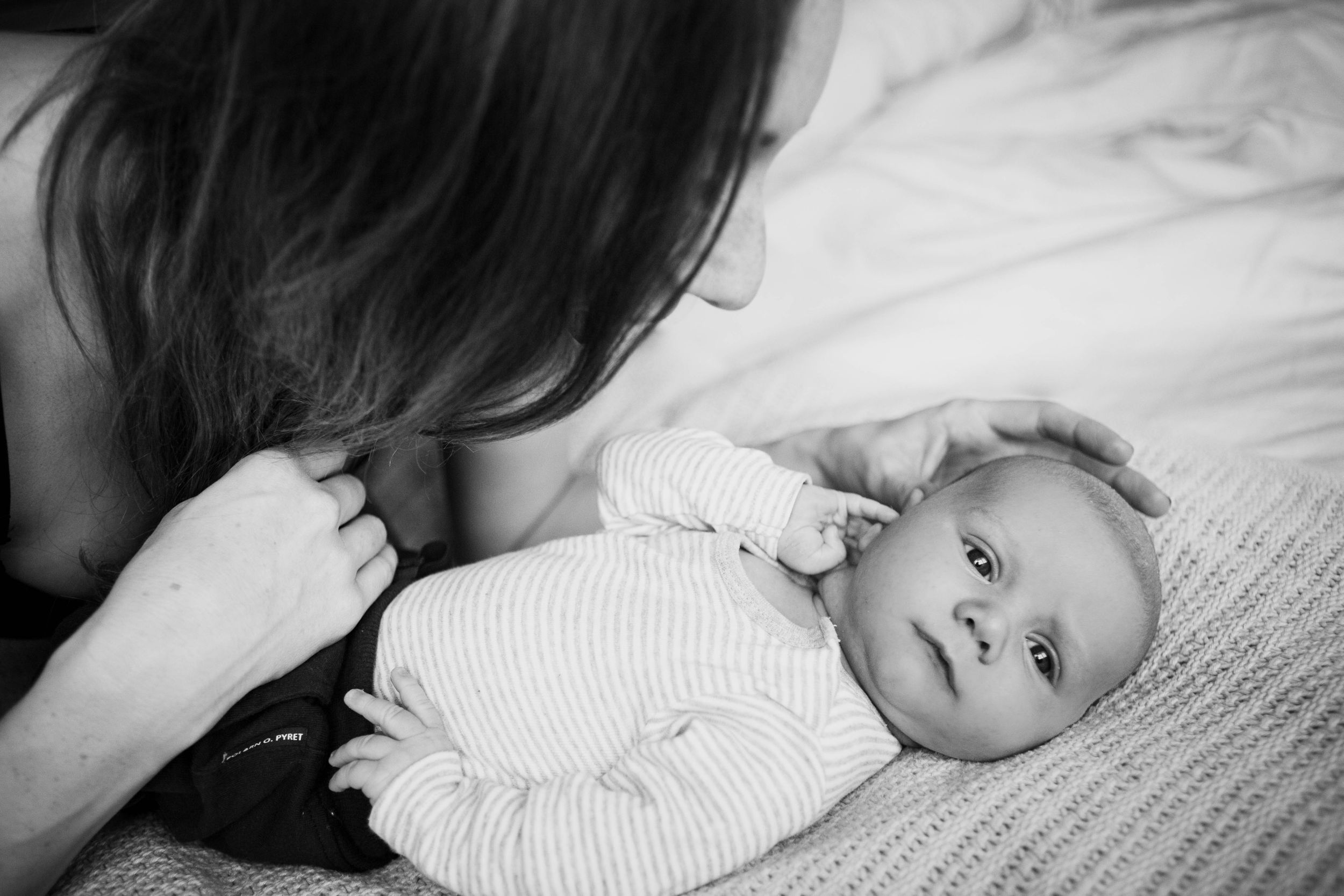 mum touching baby boy head