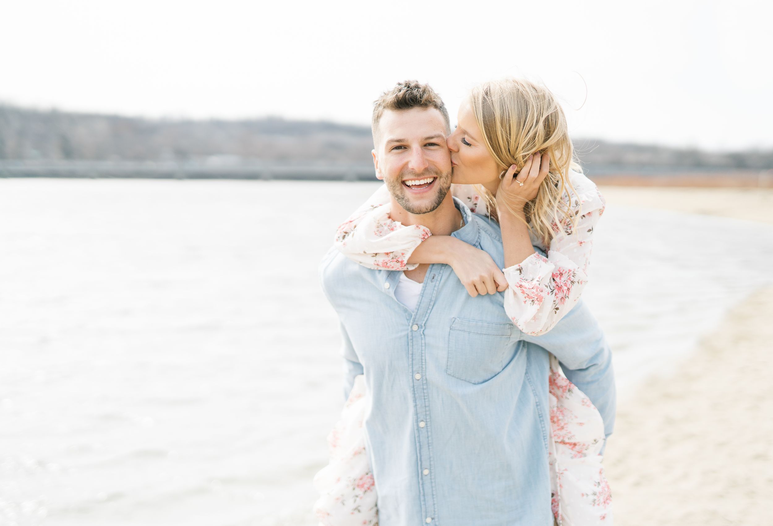 Light and airy film lakeside dock engagement session at Gray's Lake in Des Moines, Iowa