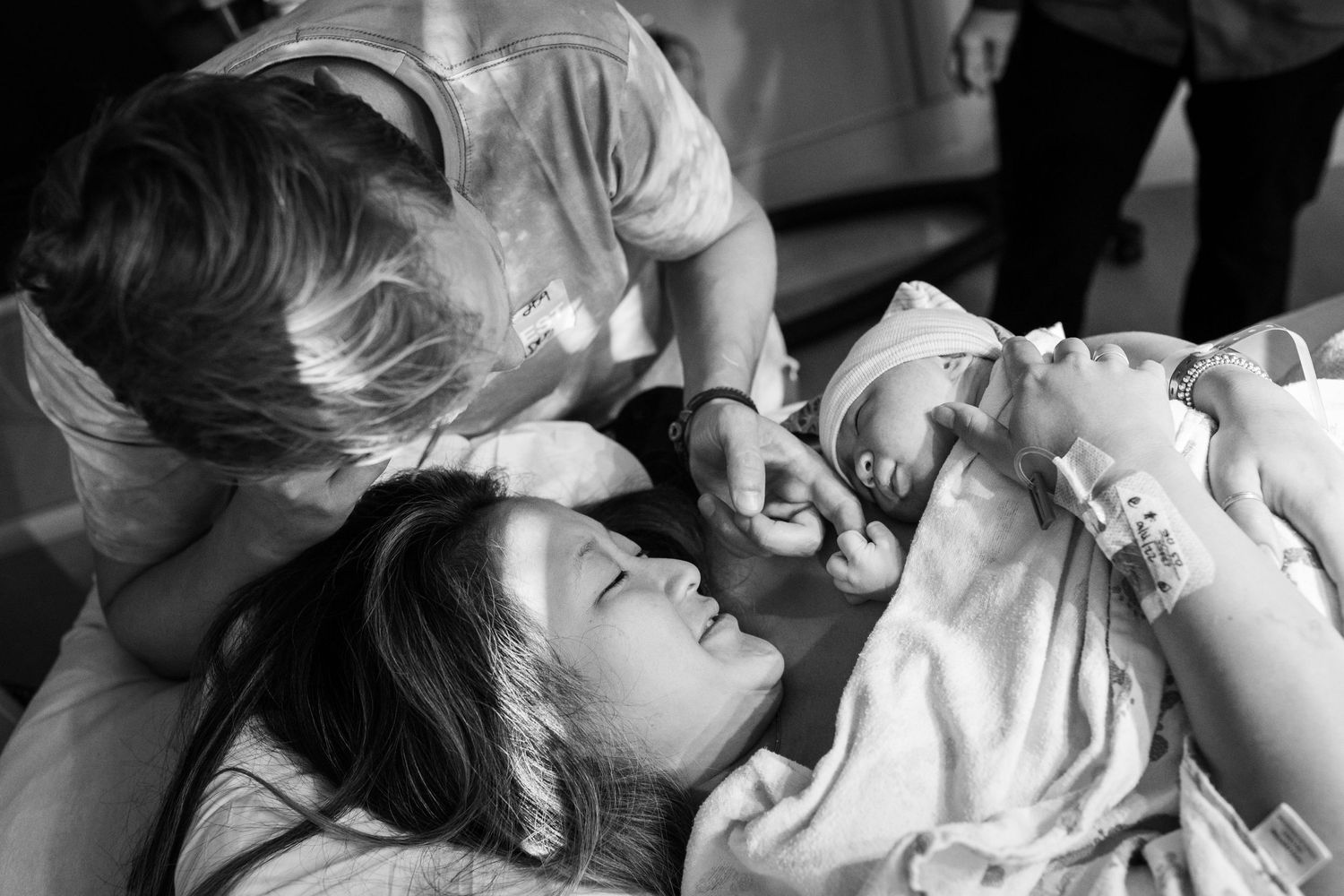New parents gazing at their son seconds after his birth in San Diego