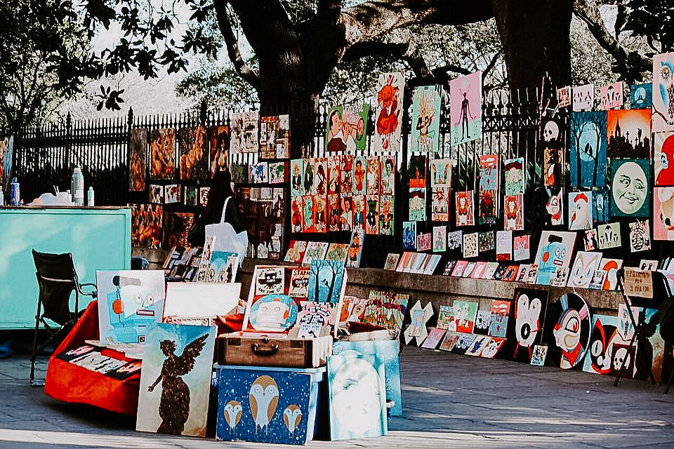 a mass of colorful art pieces in Jackson Square French Quarter New Orleans French Quarter Elopement