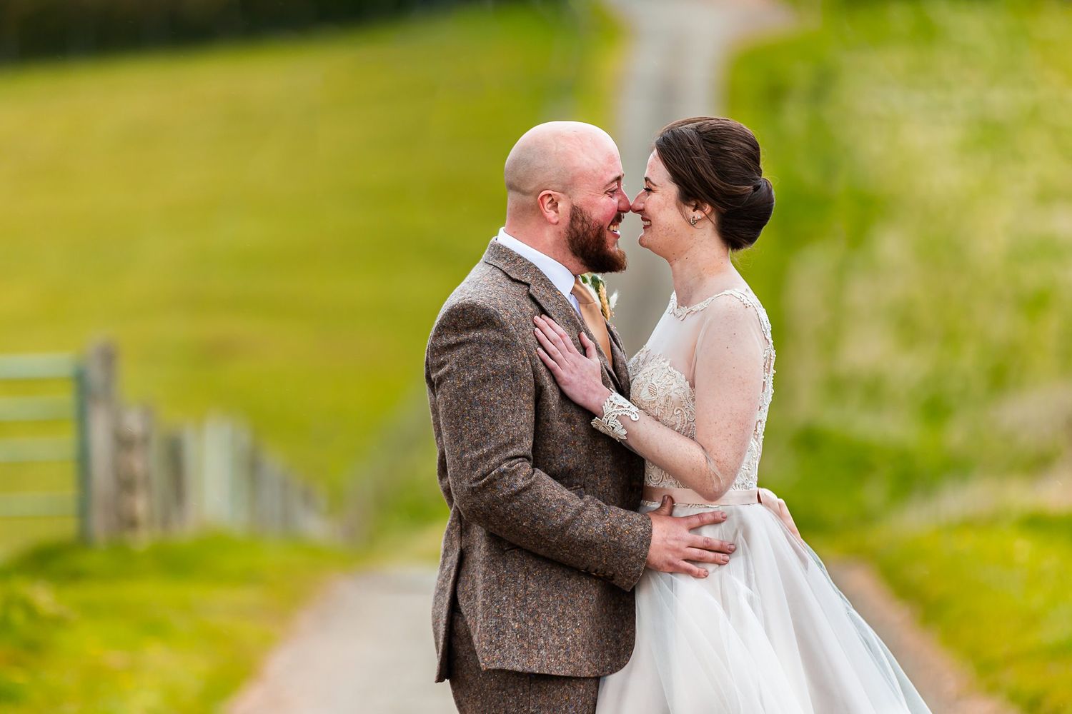 bride and groom looking at one another touching noses