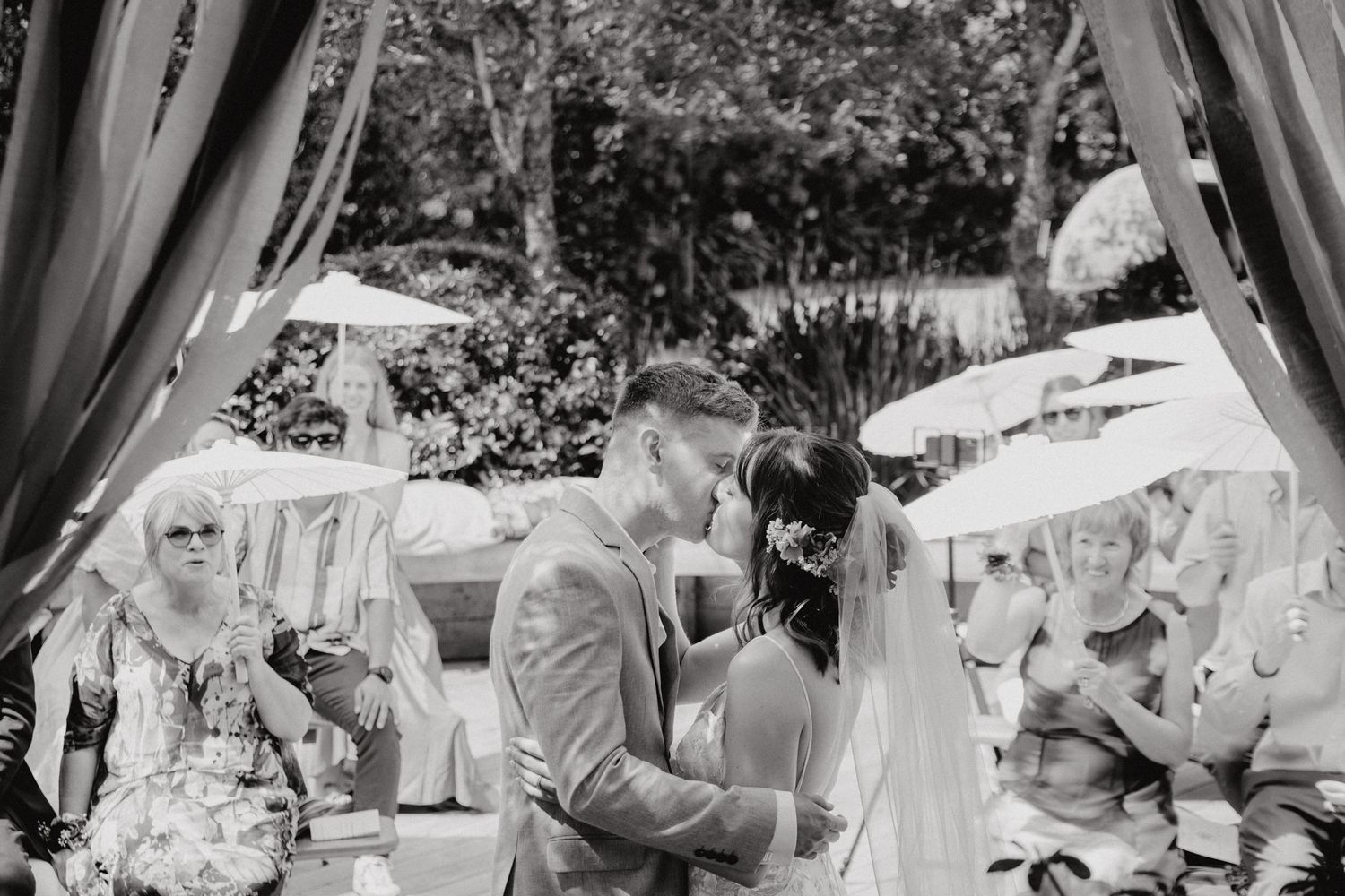 Newly weds with their first kiss captured by Apertured Media Auckland Wedding Photographer.