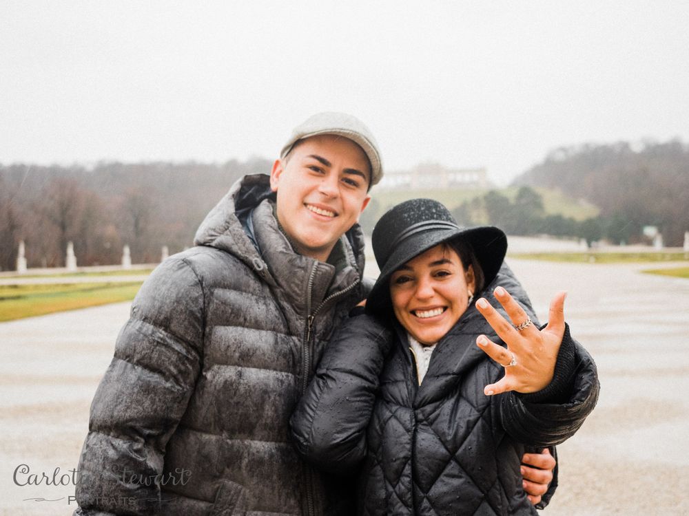 Happy couple showing the engagement ring during destination photography in Vienna, Austria