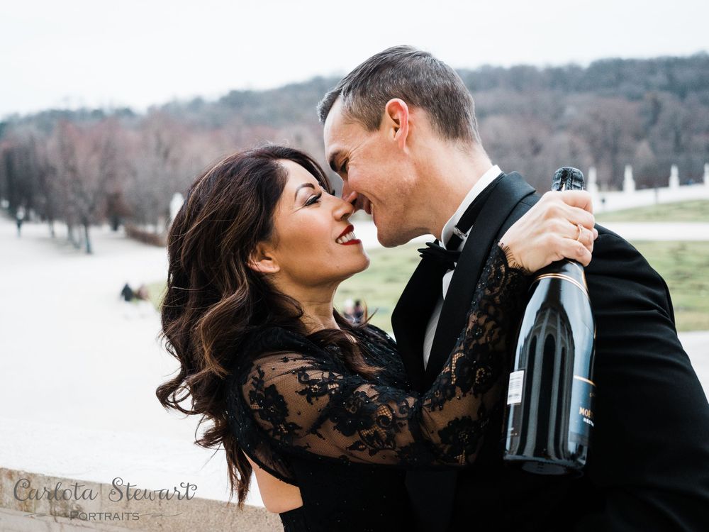 Destination photography in Vienna Austria, with a coupe holding a bottle of Moet Chandon in Schönbrunn palace, Austria