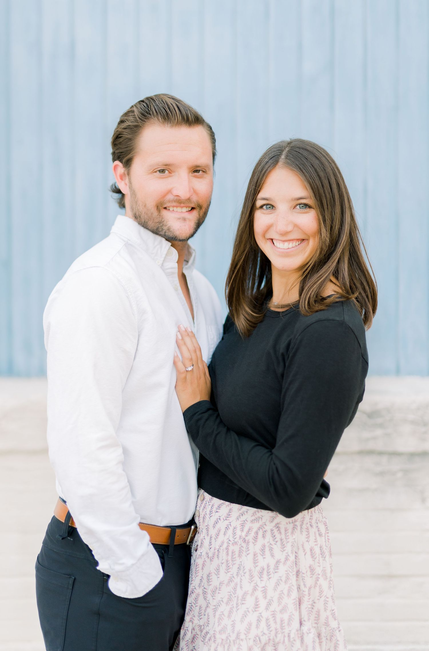 Des Moines Engagement photos in downtown Des Moines, Iowa with light and airy photographer Nicole Laing