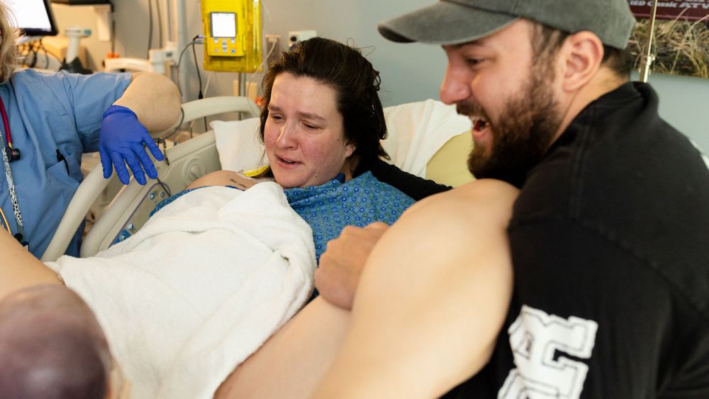 Parents see their son for the first time as he is being born in Longmont Colorado.