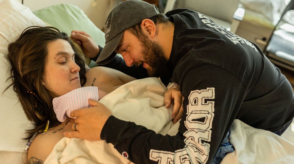 Colorado birth photographer catches first moments of parents with their son in the hospital after birth